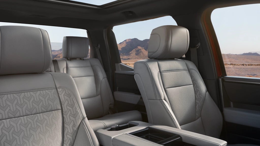 Spacious interior of the 2025 Toyota Tundra with premium seating and panoramic view of the desert landscape