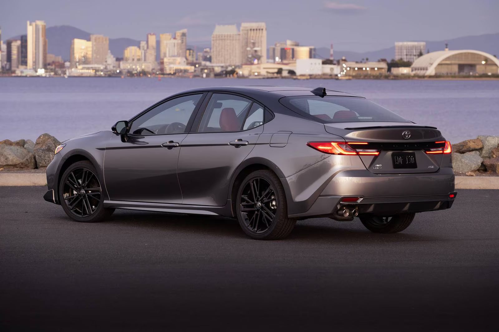 A gray car sitting parked.