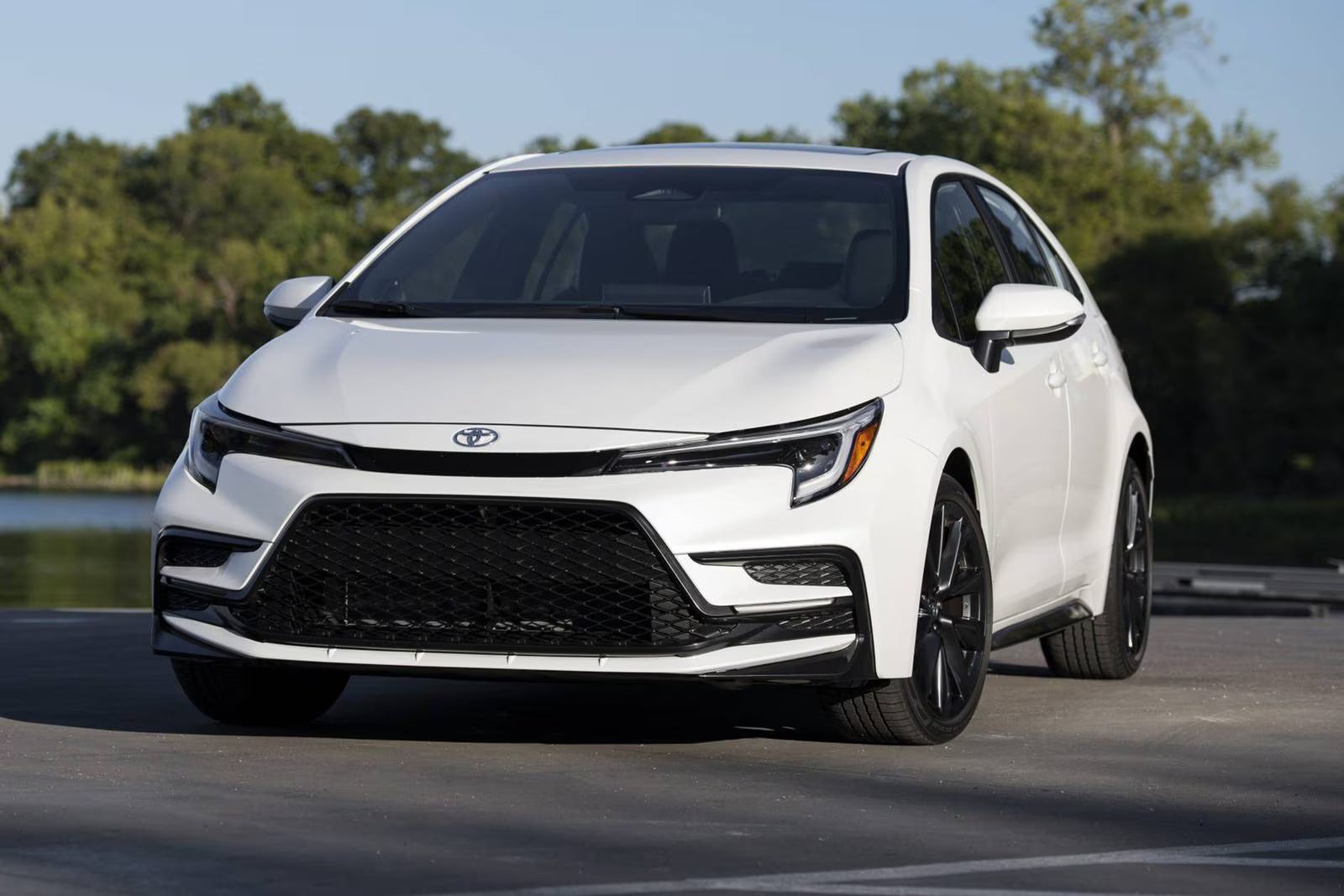 A red car driving on the road.