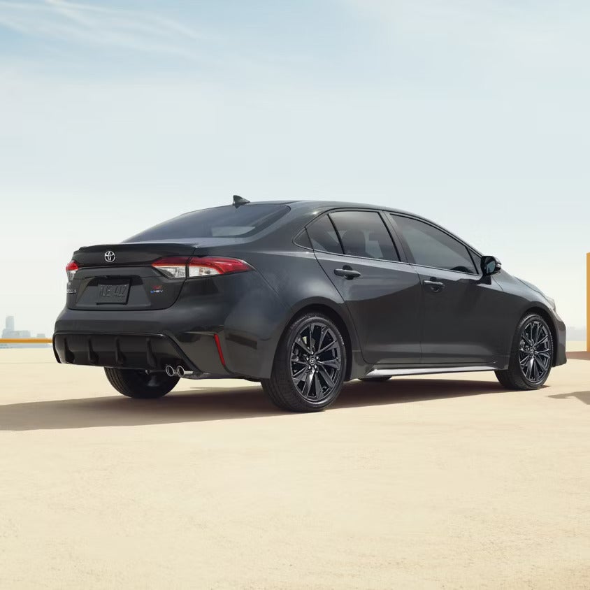 A gray car sitting parked.