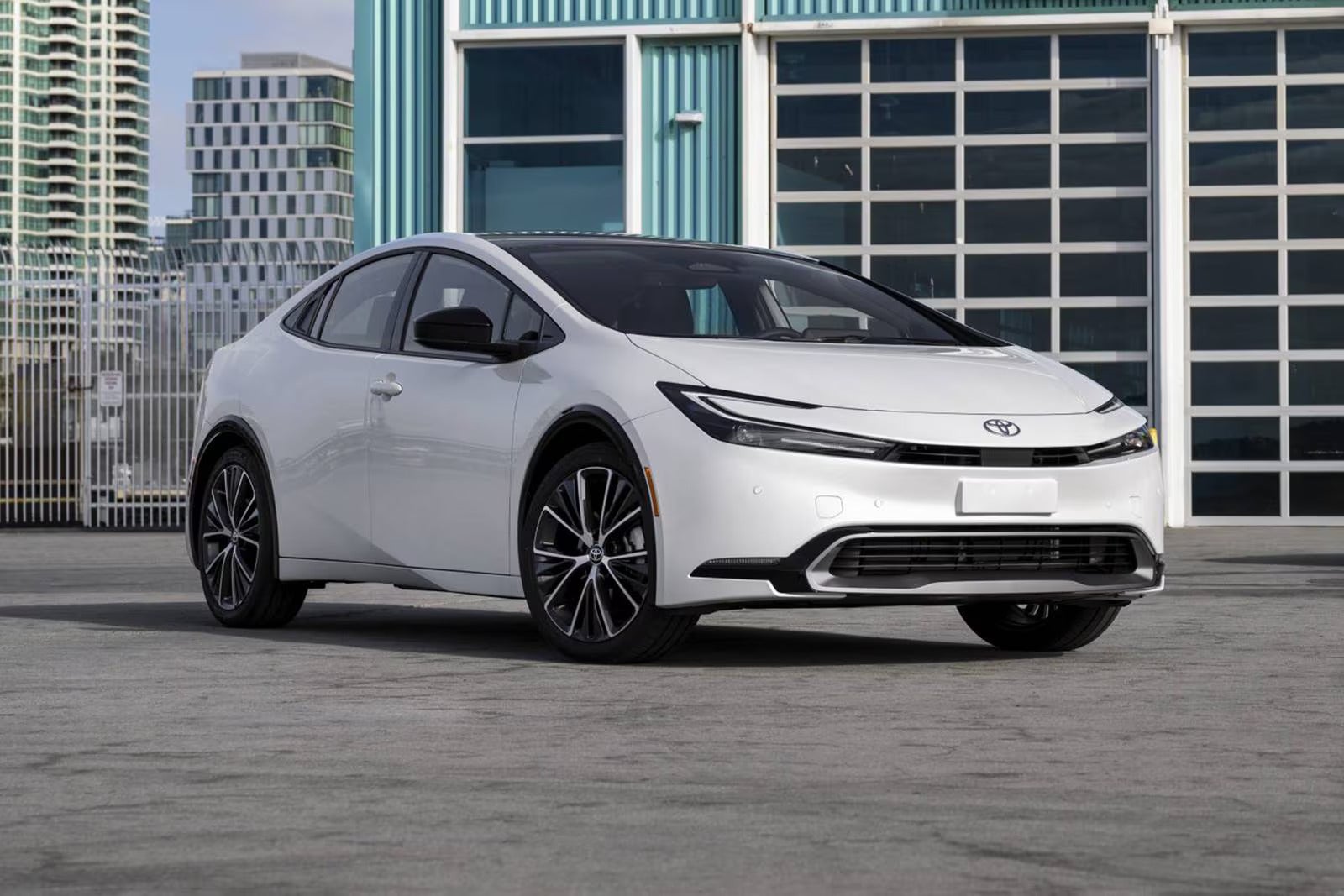 A yellow car driving on the road.