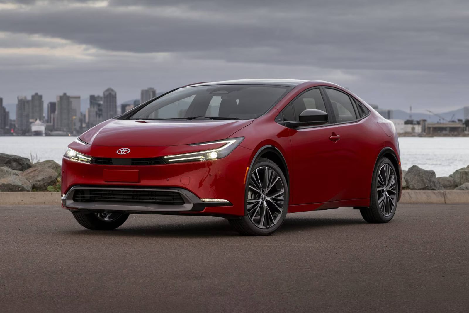 A red car sittting parked.
