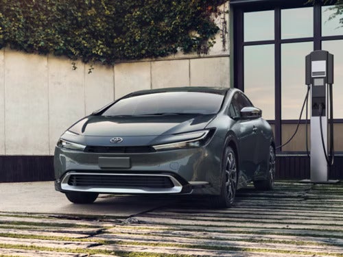 A gray car being chargerd.