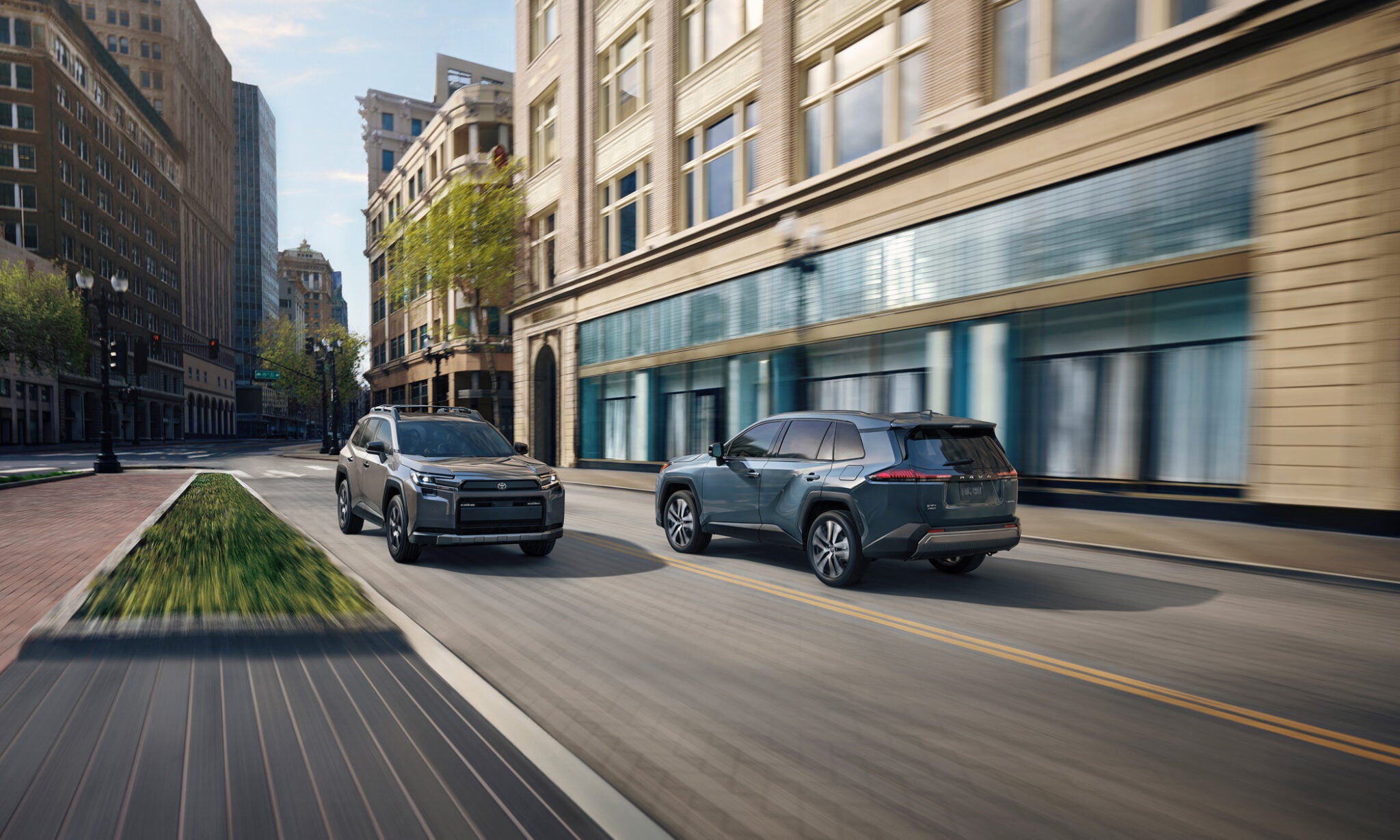 Two suv driving on the road.