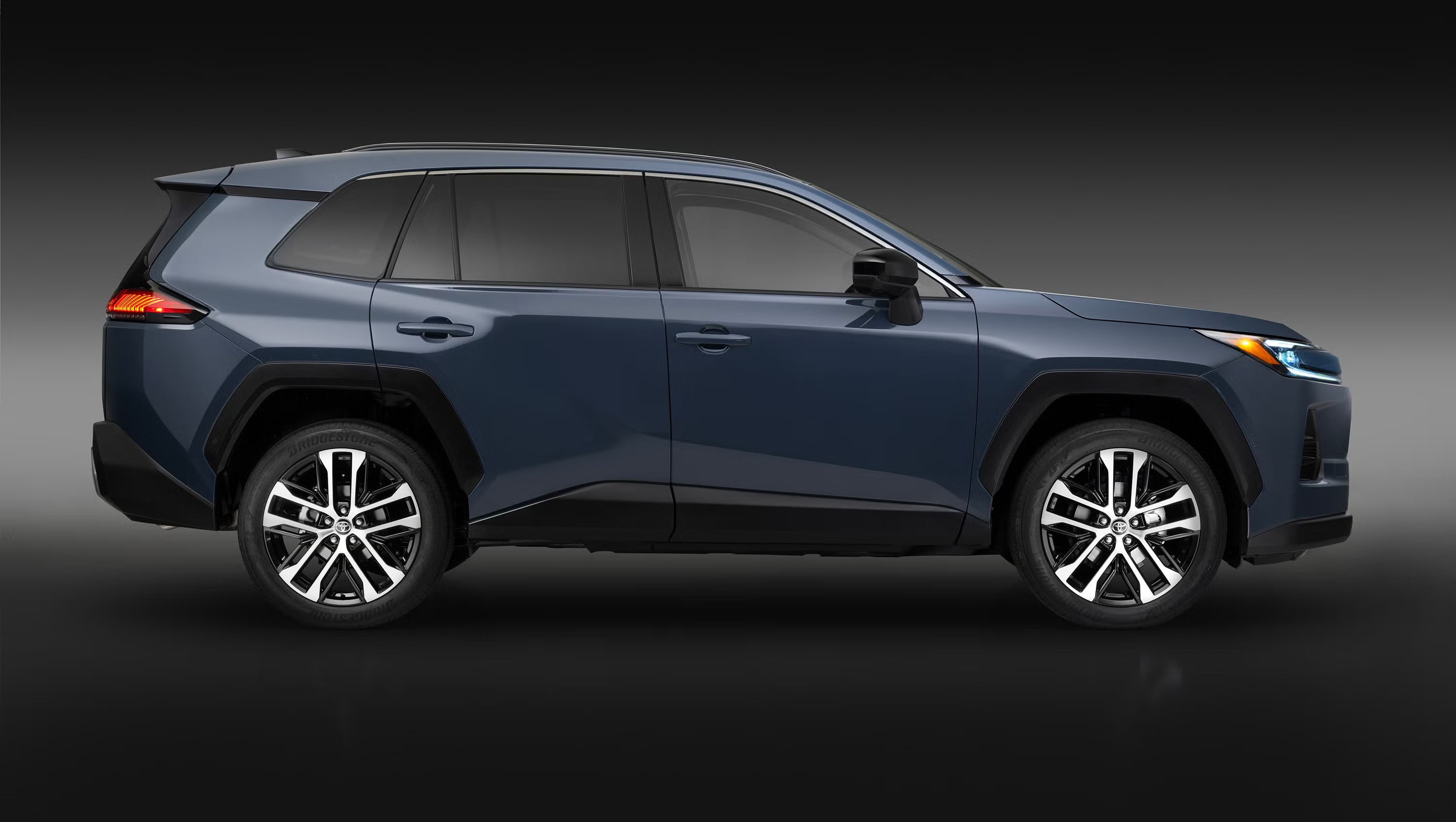 A blue suv sitting parked.