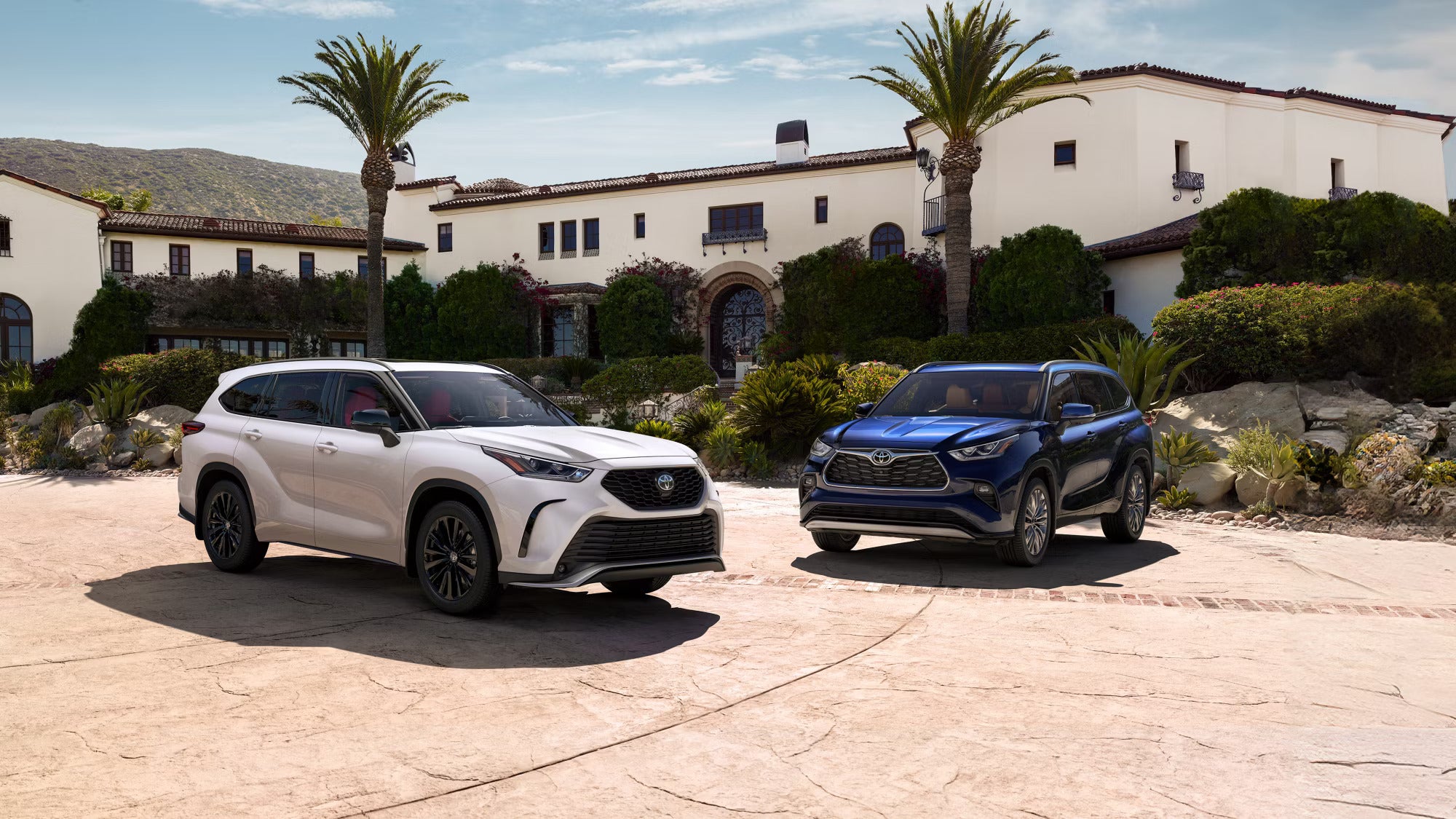 A wgite suv driving on the snow.