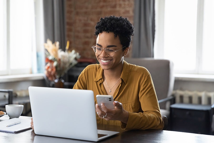 women looking at her computer at home